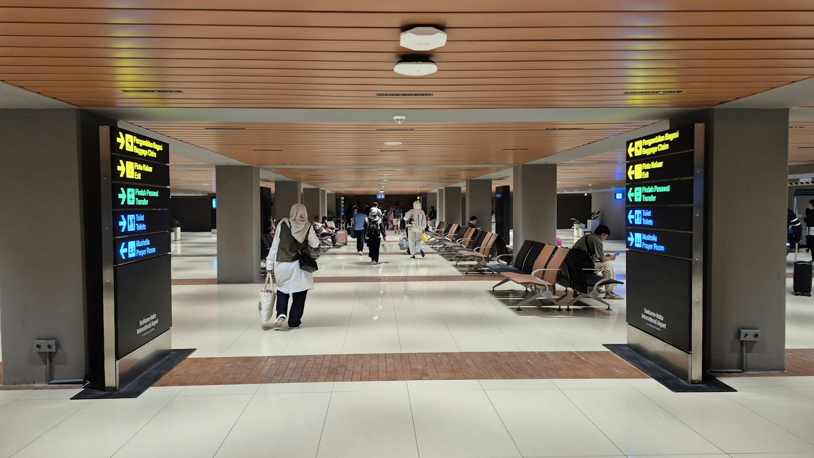 Travelers walking through an airport terminal